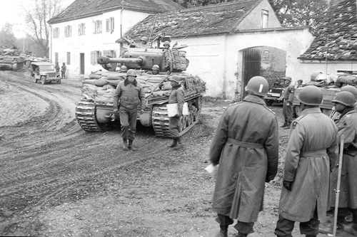 George Patton having just scolded a tank crew for timidly sandbagging a tank, Germany, May 1945