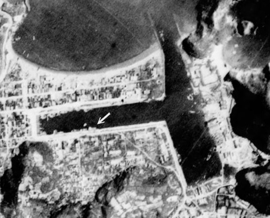 Harbor under attack by a PB4Y-1 aircraft of US Navy VPB-104 squadron, Suo, Taihoku Prefecture (now Su'ao, Yilan County), Taiwan, 24 Jun 1945, photo 1 of 3