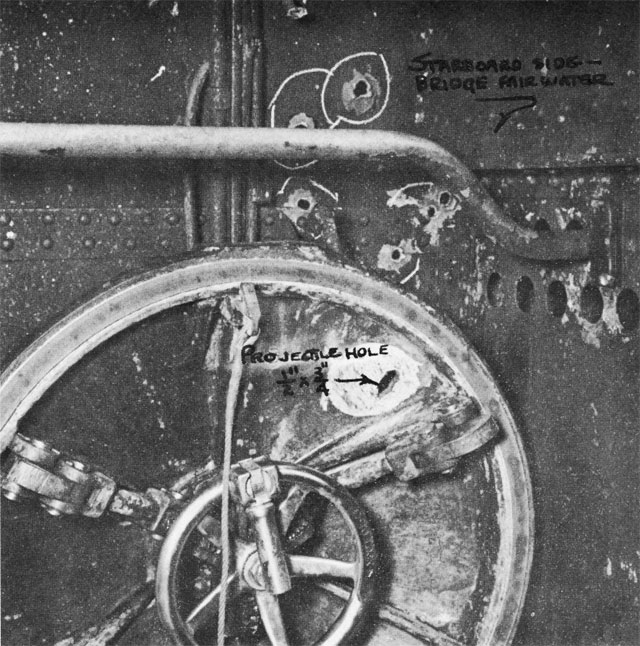 Bullet hole through USS Growler’s main hatch sustained 7 Feb 1943. Photo taken at the New Farm Submarine Base, Brisbane, Queensland, Australia, mid-Feb 1943.