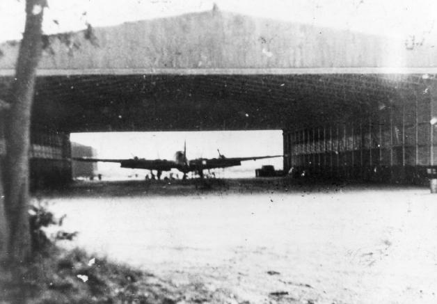 A B-17 Fortress bomber inside a hangar at RAF Thurleigh, Bedfordshire, England, circa 1944.