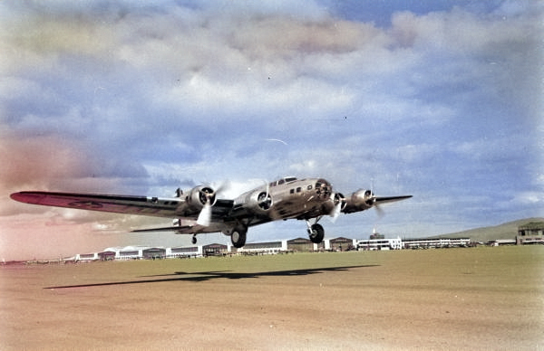 Early model Boeing B-17 Fortress taking off from Hickam Field, Oahu, Territory of Hawaii, pre-war, Aug 1941. [Colorized by WW2DB]