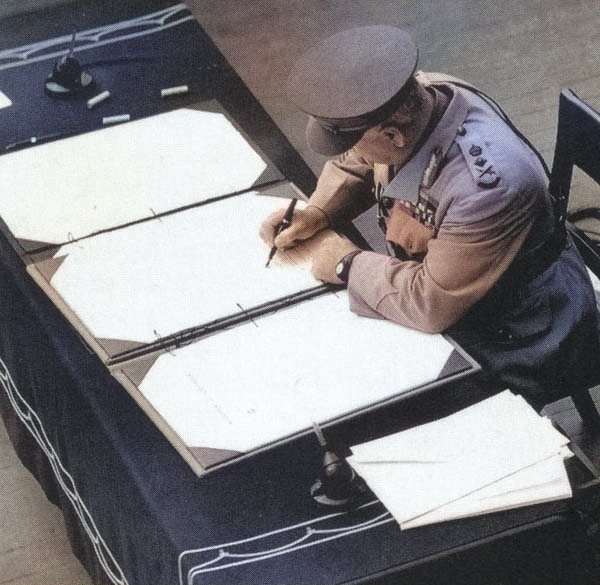 General Sir Thomas Blamey signing the Japanese surrender document on behalf of Australia aboard USS Missouri, 2 Sep 1945. [Colorized by WW2DB]