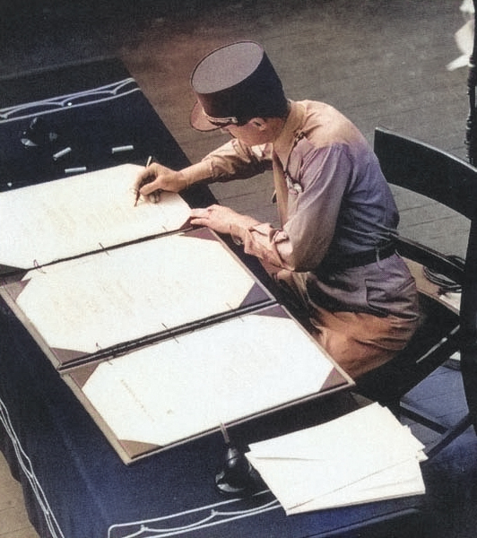 General Philippe LeClerc signing the surrender instrument on behalf of France aboard USS Missouri, Tokyo Bay, Japan, 2 Sep 1945 [Colorized by WW2DB]