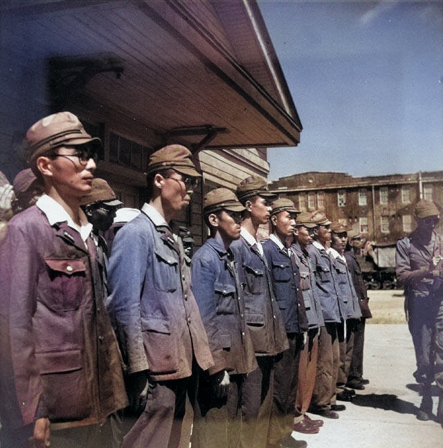 Japanese personnel standing in formation during the surrender of Yokosuka Naval Base, Japan, 30 Aug 1945 [Colorized by WW2DB]