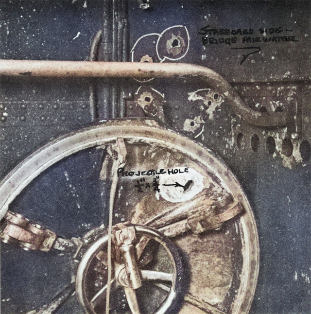 Bullet hole through USS Growler’s main hatch sustained 7 Feb 1943. Photo taken at the New Farm Submarine Base, Brisbane, Queensland, Australia, mid-Feb 1943. [Colorized by WW2DB]