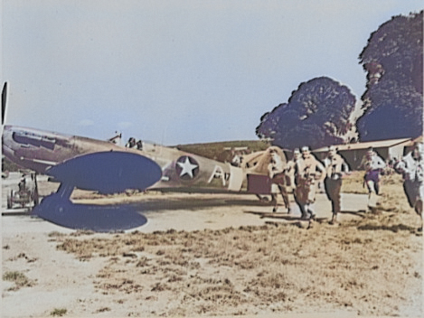 Pilots of the 309th Fighter Squadron, USAAF 31st Fighter Group running to their Spitfire Mk VB fighters, United Kingdom, 1942 [Colorized by WW2DB]