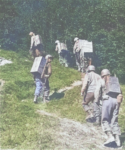 American troops carrying supplies inland from Anzio, Italy, May-Jun 1944 [Colorized by WW2DB]