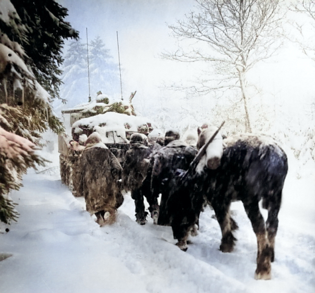 Troops of US 82nd Airborne Division marching behind M4 Sherman tank in a snowstorm toward German occupied town of Herresbach, Belgium, 28 Jan 1945 [Colorized by WW2DB]