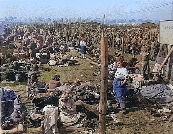 Female members of the German military in a prisoner of war camp for women at Regensburg, Germany, 8 May 1945 [Colorized by WW2DB]