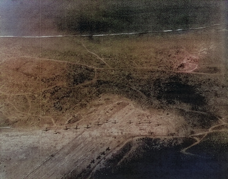 View of an airfield on Iwo Jima, Japan, 7 Mar 1945; photo taken from an aircraft of USS Anzio [Colorized by WW2DB]