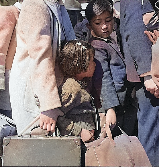 Japanese-American children awaiting for a bus that would take them to an Assembly Center, Byron, California, United States, 2 May 1942 [Colorized by WW2DB]