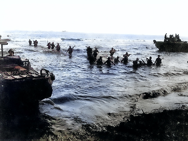 US Marines wading toward Tinian from amphibious tractors and landing boats, Mariana Islands, 25 Jul 1944, photo 2 of 3 [Colorized by WW2DB]