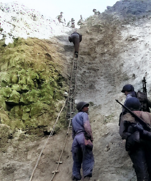 US Army Rangers showing off the ladders they used to storm the cliffs of Pointe du Hoc, Normandy, France, 6 Jun 1944 [Colorized by WW2DB]