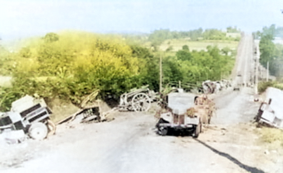 Abandoned German equipment on a road to Avranches, France during Operation Cobra, 31 Jul 1944 [Colorized by WW2DB]