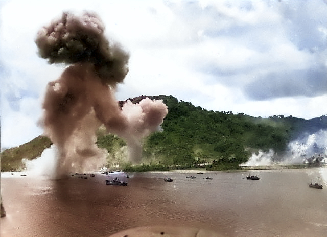 Japanese naval base, warships, and fishing boats at Dublon Island under American aerial attack, Truk Atoll, Caroline Islands, 16 Feb 1944, photo 2 of 2 [Colorized by WW2DB]