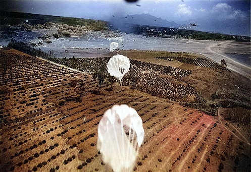 US bombers attacking Lamsepo Airfield with parafrag bombs, Linkou, Taiwan, 14 Apr 1945, photo 1 of 3 [Colorized by WW2DB]