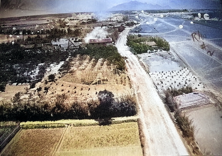 US bombers attacking Lamsepo Airfield with parafrag bombs, Linkou, Taiwan, 14 Apr 1945, photo 3 of 3 [Colorized by WW2DB]