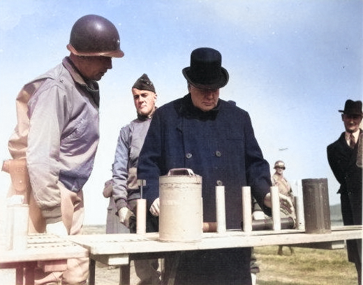 Winston Churchill being shown various weapons, England, United Kingdom, 15 May 1944, photo 1 of 2; note Major General Edward Brooks in background [Colorized by WW2DB]