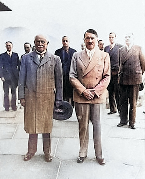 Former British Prime Minister David Lloyd George and German leader Adolf Hitler at Obersalzberg, Berchtesgaden, Bavaria, Germany, 7 Jun 1936; note Ribbentrop in background center [Colorized by WW2DB]