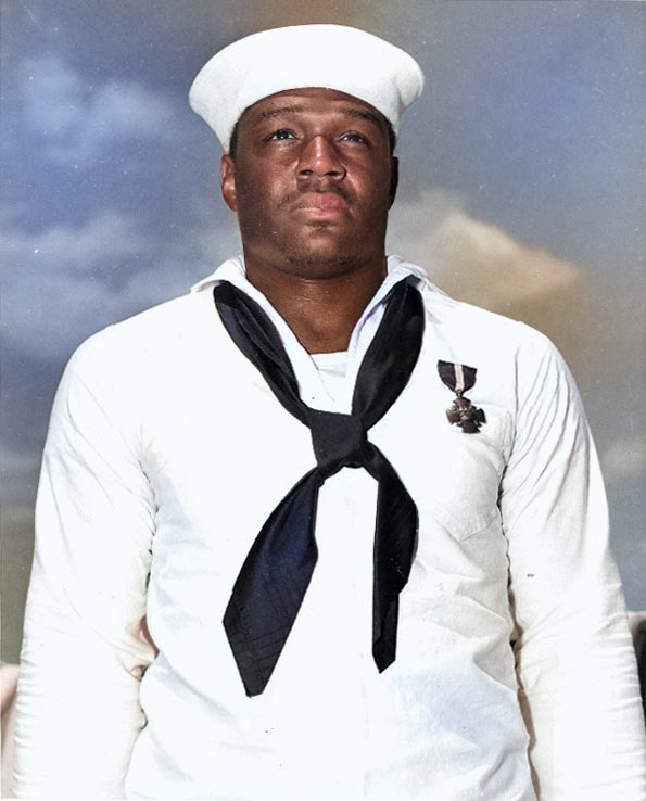 Doris Miller wearing the the Navy Cross medal, having just been awarded from Admiral Chester Nimitz, onbard carrier Enterprise, Pearl Harbor, US Territory of Hawaii, 27 May 1942 [Colorized by WW2DB]