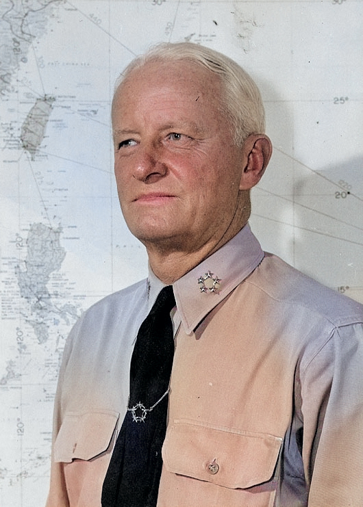 Portrait of US Navy Fleet Admiral Chester Nimitz at his office in Guam, Mariana Islands, circa 16-19 Dec 1944; note five-star tie clasp, which was a gift to him [Colorized by WW2DB]