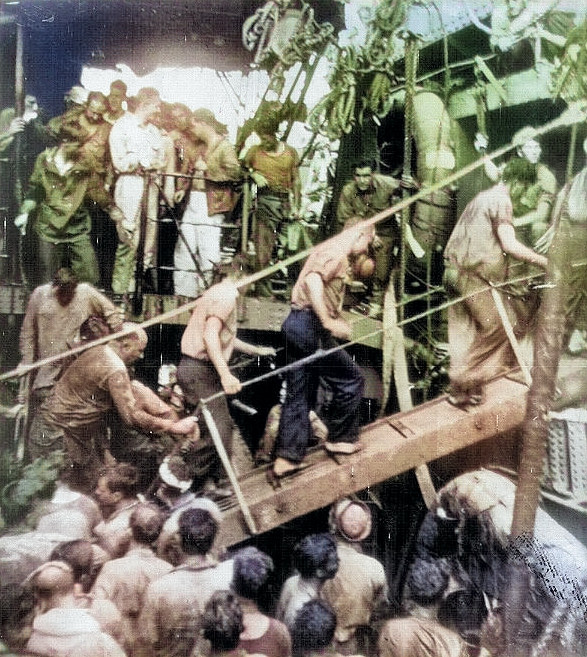 Survivors of USS Helena being transferred from destroyer USS Nicholas to cruiser USS Honolulu, Tulagi, Solomon Islands, 6 Jul 1943, photo 3 of 3 [Colorized by WW2DB]