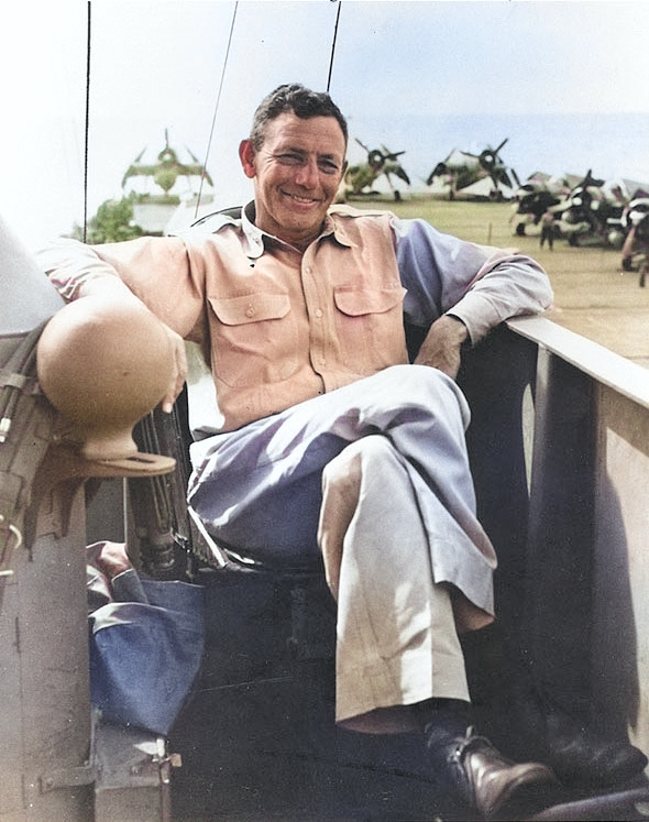 Rear Admiral Calvin T. Durgin on the bridge of his flagship, USS Makin Island, late-1944 to mid-1945; note FM-2 Wildcat and TBM Avenger aircraft on the flight deck [Colorized by WW2DB]