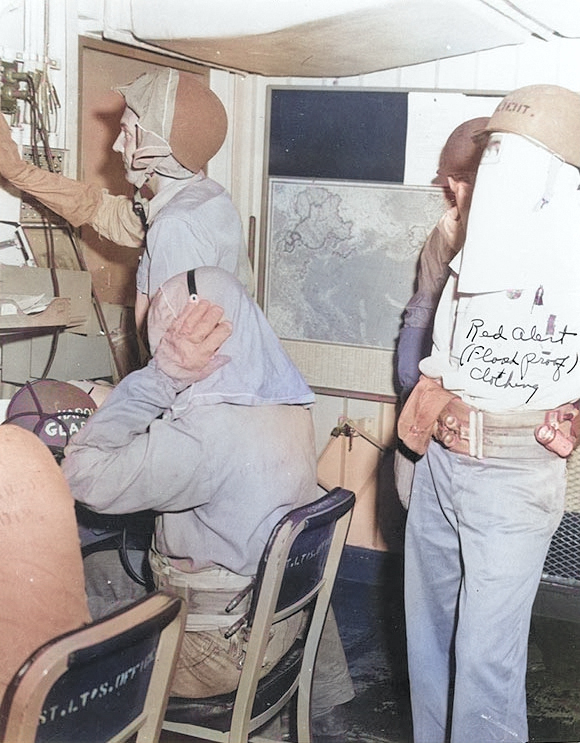 Crew members of USS Makin Island at their battle stations with inflatable belts and flash proof clothing, late 1944-mid 1945 [Colorized by WW2DB]