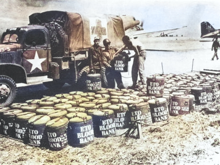 Blood and plasma moving from Britain to the front lines in France, 1944; note C-47 Skytrain aircraft and GMC CCKW 2 1/2-ton 6x6 short wheel-base truck [Colorized by WW2DB]