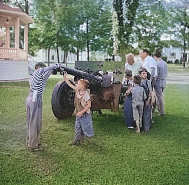 Civilians looking at a French-built 75mm field gun, Bristol, Vermont, United States, Jul 1940 [Colorized by WW2DB]