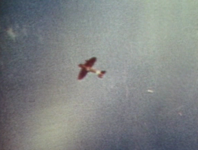 D3A1 carrier dive bomber in flight over Sand Island, Midway Atoll, 4 Jun 1942