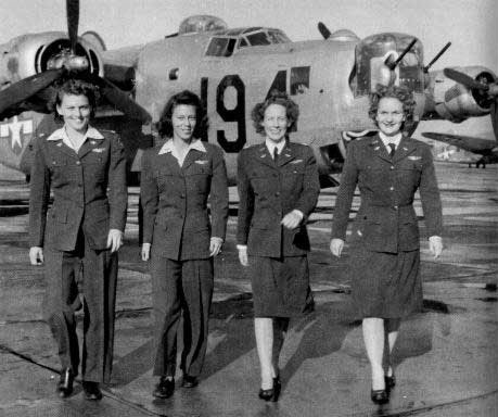 WASP pilots Eloise Huffines Bailey, Millie Davidson Dalrymple, Elizabeth McKethan Magid, and Clara Jo Marsh Stember in front of their B-24 aircraft, Aug 1943-Jan 1947