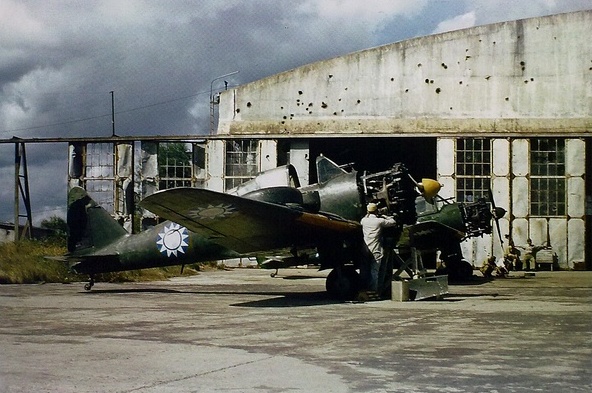 Captured Ki-36 aircraft with Chinese markings, Hangzhou, Zhejiang Province, China, circa Oct 1945; note damage on building wall