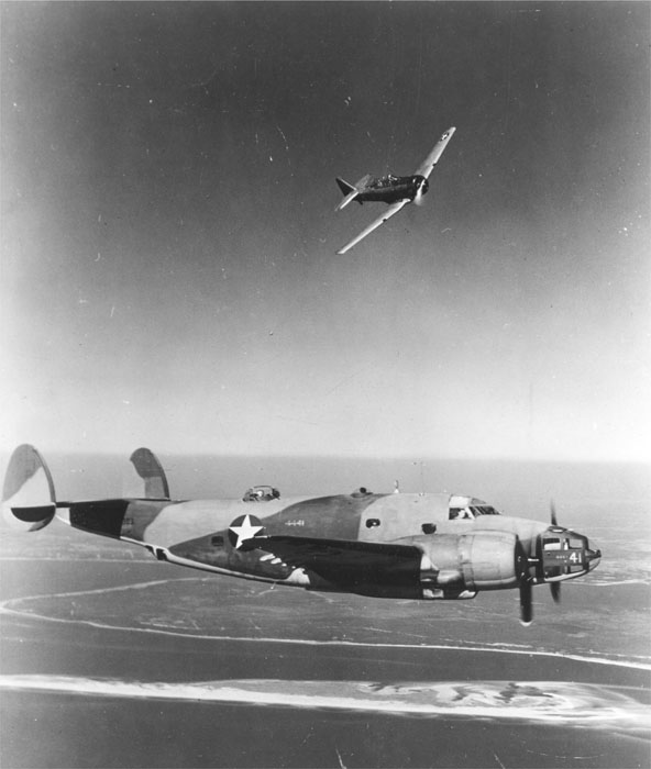 US Army Air Force student pilot in a T-6 Texan trainer practicing an attack on a B-34 bomber, circa 1942-1943