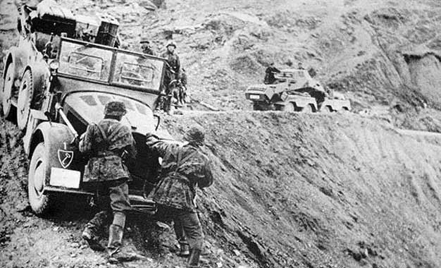 Troops of the Leibstandarte SS Adolf Hitler negotiating difficult terrain in Greece, 1941