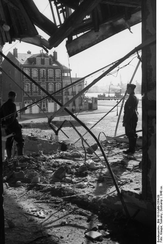 German soldiers standing in the ruins of a building, France, circa 1940