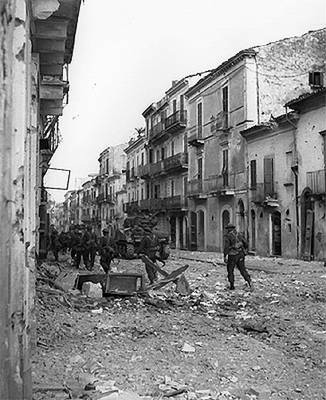 Troops of Canadian Loyal Edmonton Regiment and tank of Canadian Three Rivers Regiment, Ortona, Italy, 20-28 Dec 1943