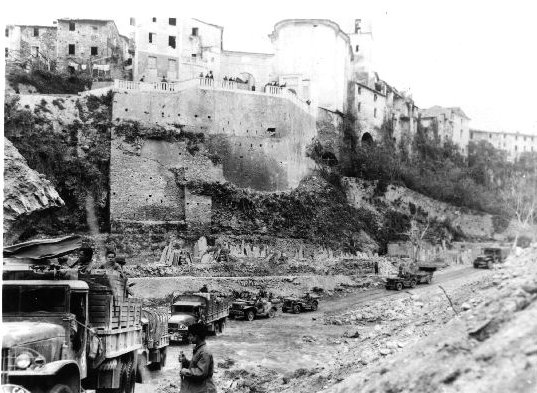 Japanese-American troops of US 442nd Regimental Combat Team moving through Massa, Italy, 1944