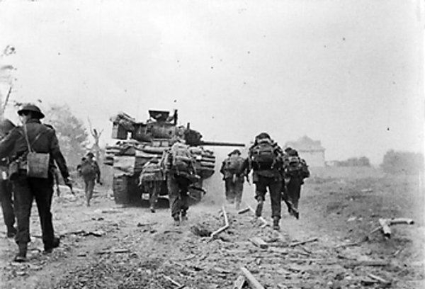 Sherman Duplex Drive tank of B Squadron, 13/18th Royal Hussars and men of No 4 Army Commando, both of British 2nd Army, near Ouistreham, Normandy, France, 6 Jun 1944