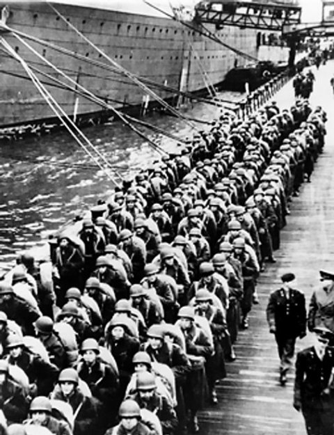 US troops waiting on a pier in England, United Kingdom, 5 Jun 1944