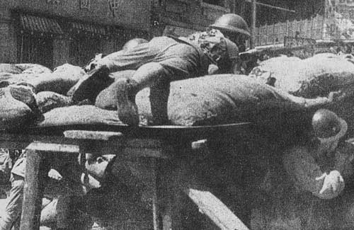 Chinese soldiers fighting at a roadblock, Shanghai, China, Sep-Oct 1937