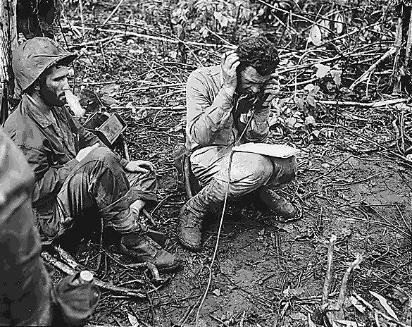 US Marine battalion commanding officer Lieutenant Colonel John Weber receiving a report from a company commander, Cape Gloucester, New Britain, Bismarck Archipelago, Jan 1944