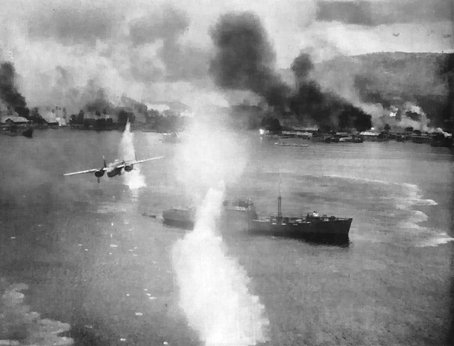 B-25 Mitchell bomber of 71st Bomb Squadron of US 38th Bomb Group flying low above a Japanese transport during a raid on Rabaul, New Britain, Nov 1943; photograph taken from the B-25 aircraft piloted by Frank Cecil