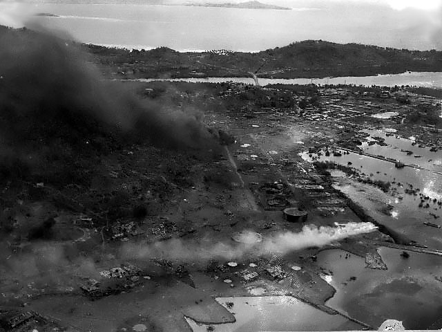 Aerial photo showing damage done to Japanese naval base at Dublon Island, Truk Atoll, Caroline Islands, 17-18 Feb 1944