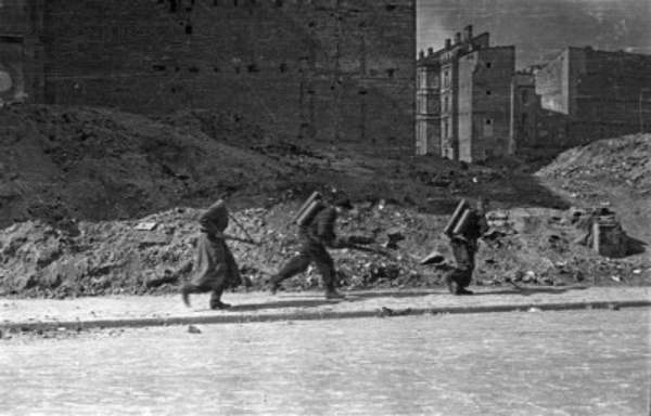 Polish insurgent fighters with flame throwers on Sienna Street, Warsaw, Poland, Aug 1944