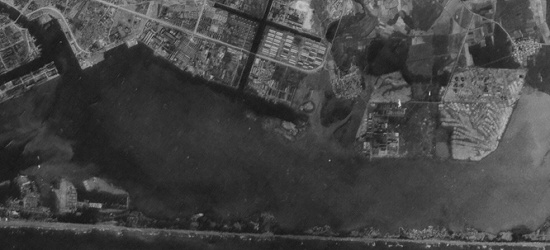 Aerial view of the former Reigaryo Airfield site and surrounding area on the coast of Takao Harbor, southern Taiwan, 1944