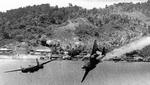 Douglas A-20G Havoc of the 387th Bomb Squadron trailing smoke and losing altitude after being damaged by anti-aircraft fire during an attack on Kokas, western New Guinea, 22 Jul 1944. Photo 2 of 4.