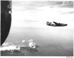 B-24J Liberator of the 431st Bomb Squadron flying over the island of Haha Jima, Japan, 1944.