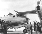 B-29 lost its prop in flight which carved hole in fuselage. Pilot made emergency landing and collided with parked aircraft causing further damage to nose and top turret. Date and location unknown. Photo 3 of 3.