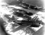 TBM-1C Avengers forming up over the Green Island airstrip, Northern Solomons, on their way to strike the Japanese. Some Avengers flying from Green Island acted as control ships for some of the first radio-controlled drone bomb strikes, 1944-45.